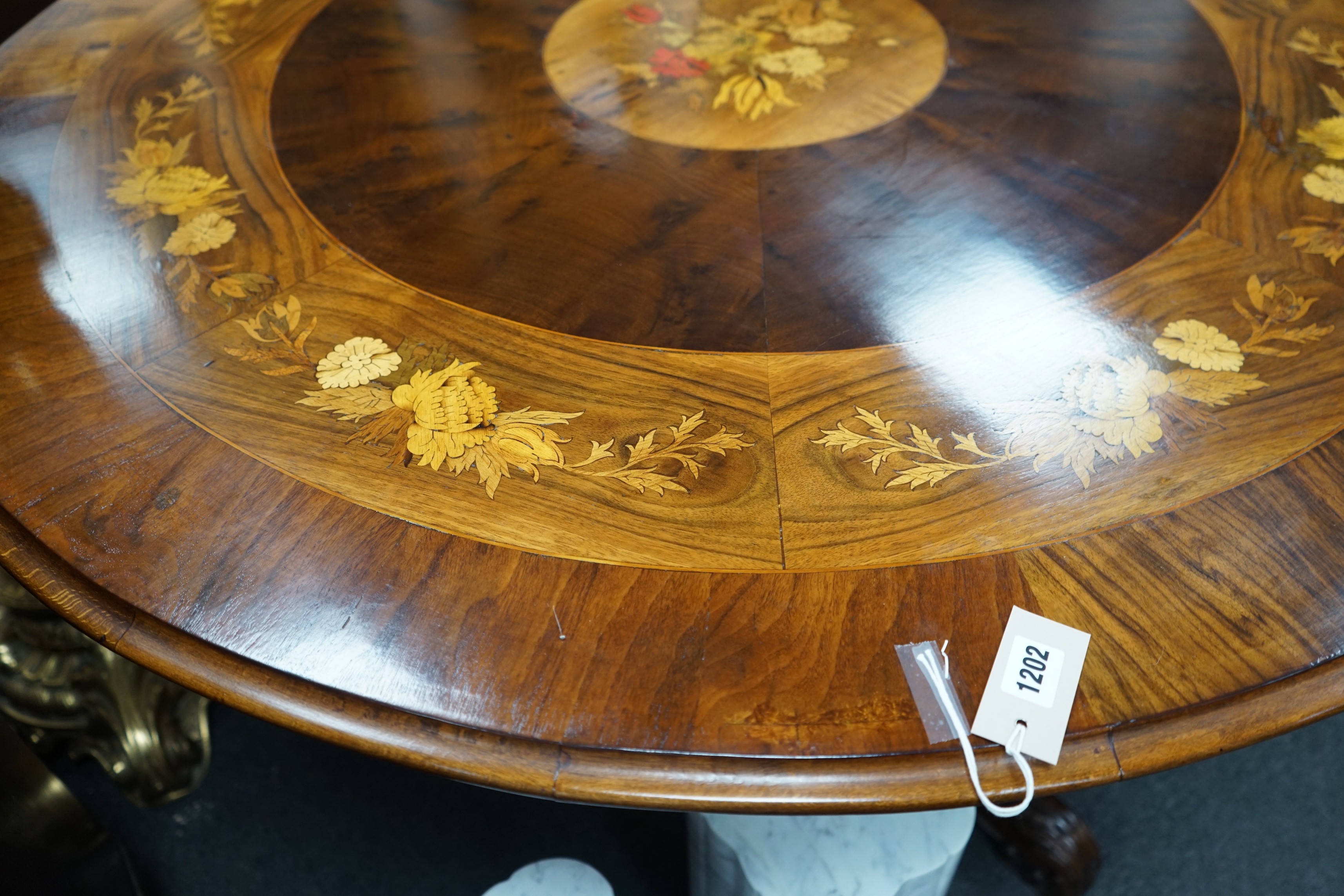 A Victorian style floral marquetry inlaid yew, walnut and rosewood circular breakfast table, diameter 130cm, height 72cm